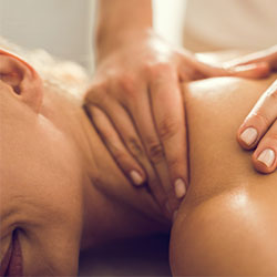 masseuse relieves pain in womans neck